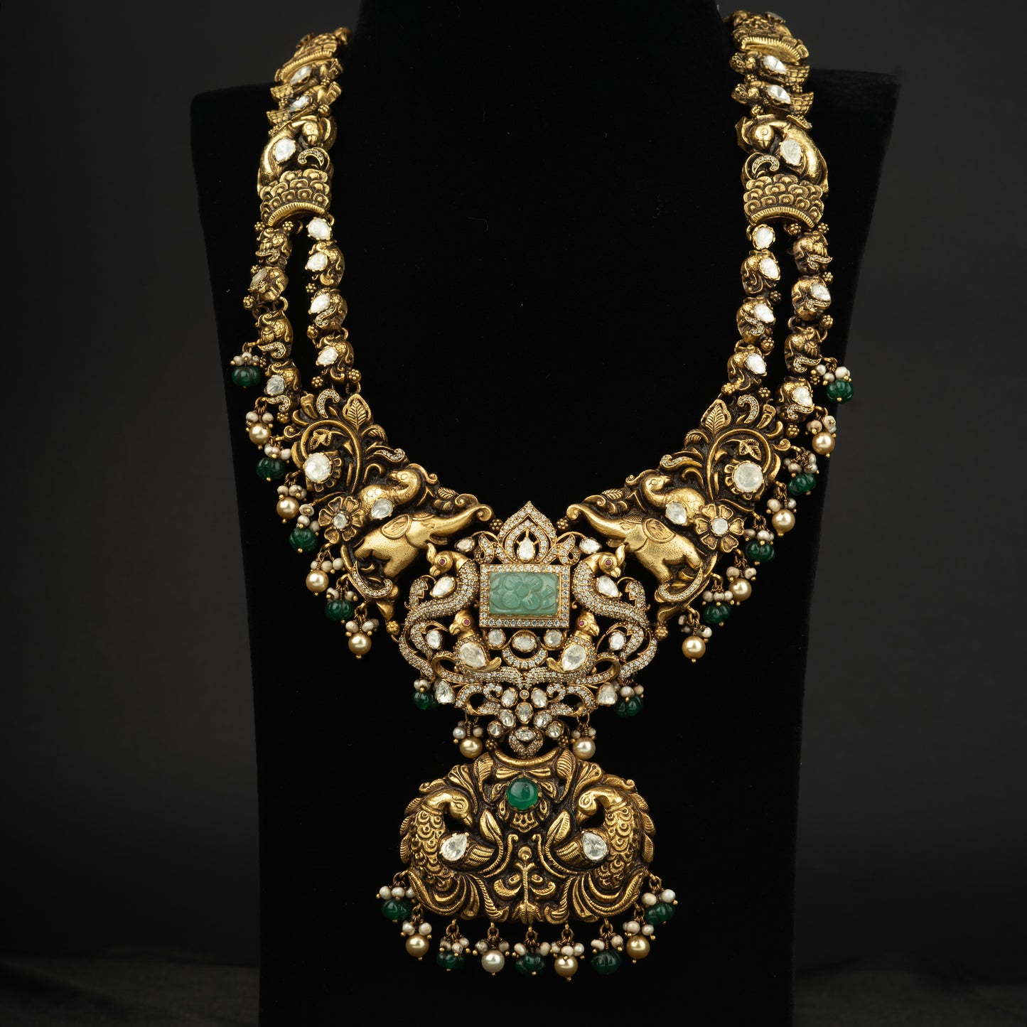 Triya CZ stone long haram, gold plated 92.5 silver haram featuring emerald and cz stones with seed pearls