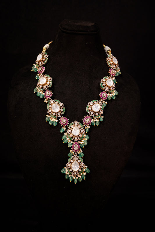 Tira Polki Necklace, Gold plated premium 92.5 silver necklace featuring timeless kundan, emerald, cubic zirconia stones, and rubies