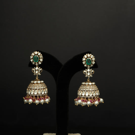 Ikshita Silver Jhumka, crafted with premium gold-plated 92.5 silver featuring timeless seed pearls, cubic zirconia, emeralds, and moissanite stones