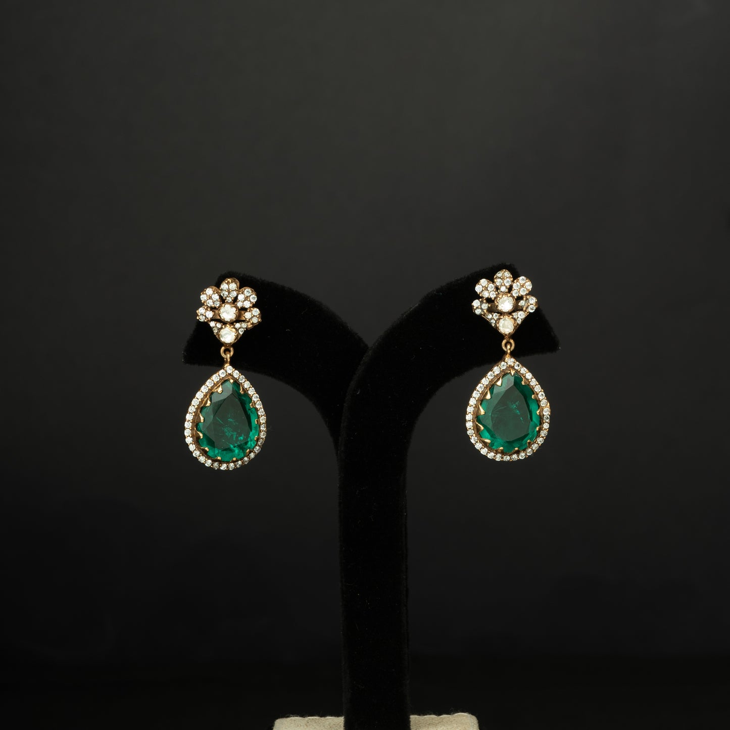 Naina Silver Earrings, crafted with premium gold-plated 92.5 silver featuring timeless  moissanite, cubic zirconia, and emerald stones