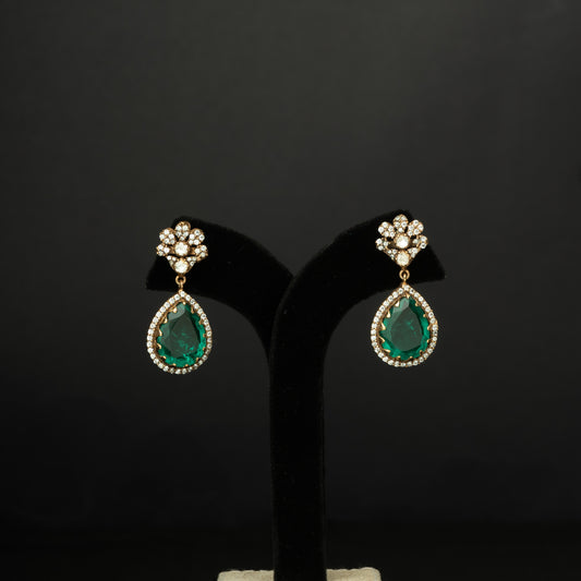 Naina Silver Earrings, crafted with premium gold-plated 92.5 silver featuring timeless  moissanite, cubic zirconia, and emerald stones