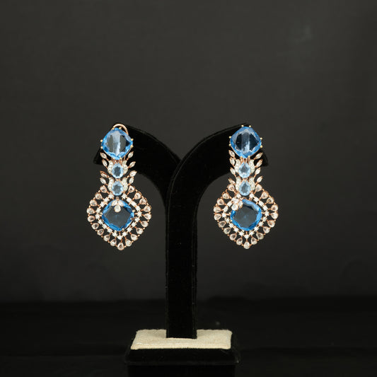 Saanvi Silver Earrings, crafted with premium gold-plated 92.5 silver featuring timeless cubic zirconia and blue sapphire stones