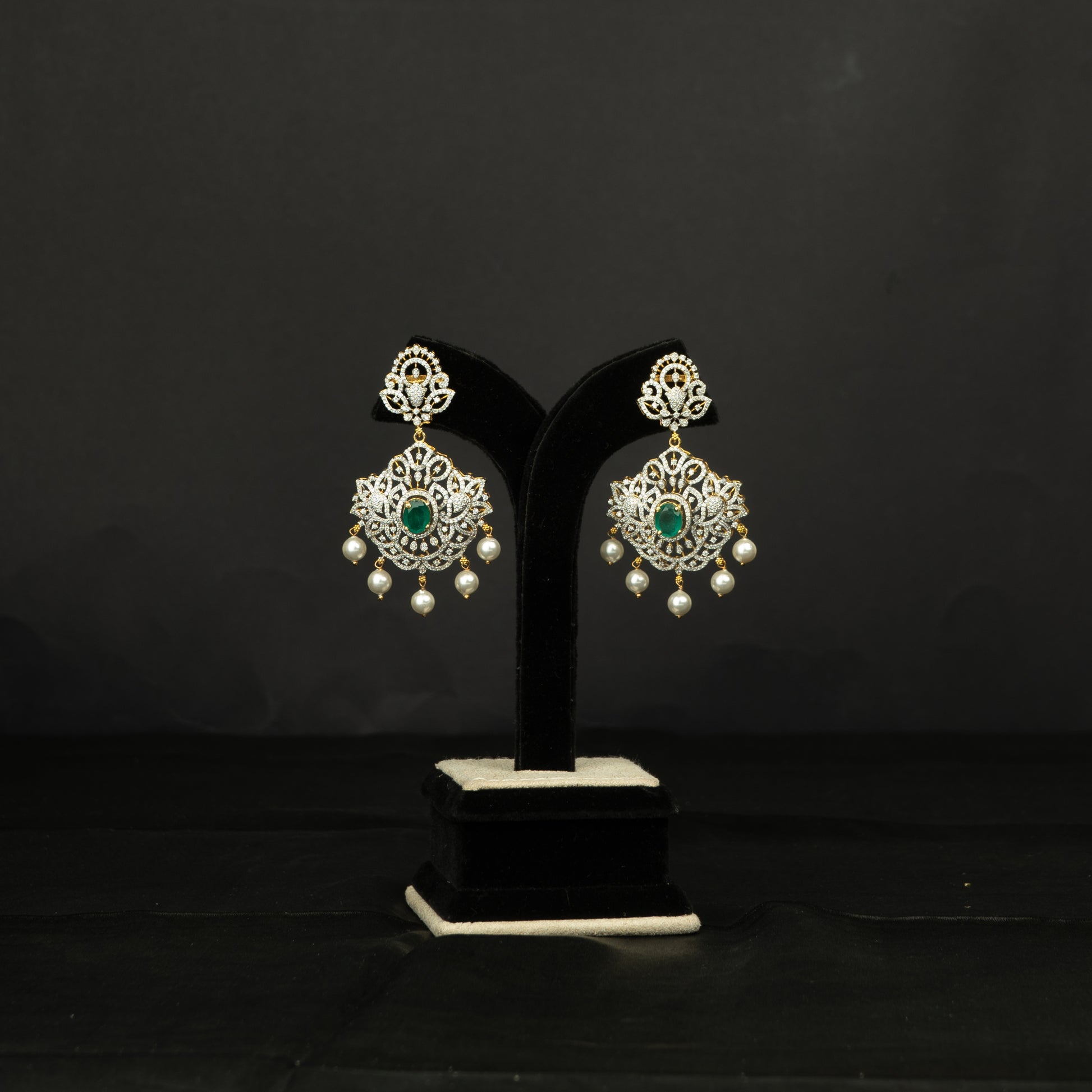 Triya Silver Earrings, crafted with premium gold-plated 92.5 silver featuring timeless beads, cubic zirconia, and emerald stones