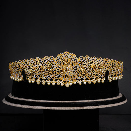 Radha Krishna CZ vaddanam, Gold plated 92.5 silver vaddanam featuring intricately crafted Radha Krishna design adorning exqusite cz stones