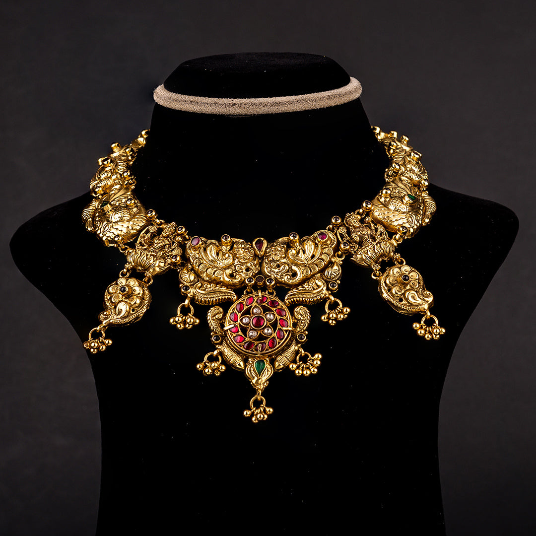 Shanaya Nakshi Necklace, Gold plated premium 92.5 silver necklace featuring timeless emeralds, moissanite, ruby potas, and rubies