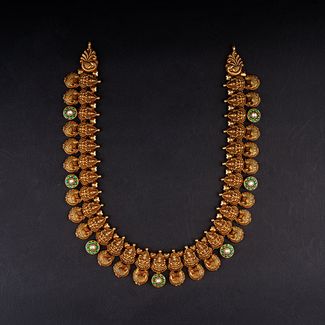 Oishi nakshi work haram, gold plated 92.5 silver haram featuring emerald stones