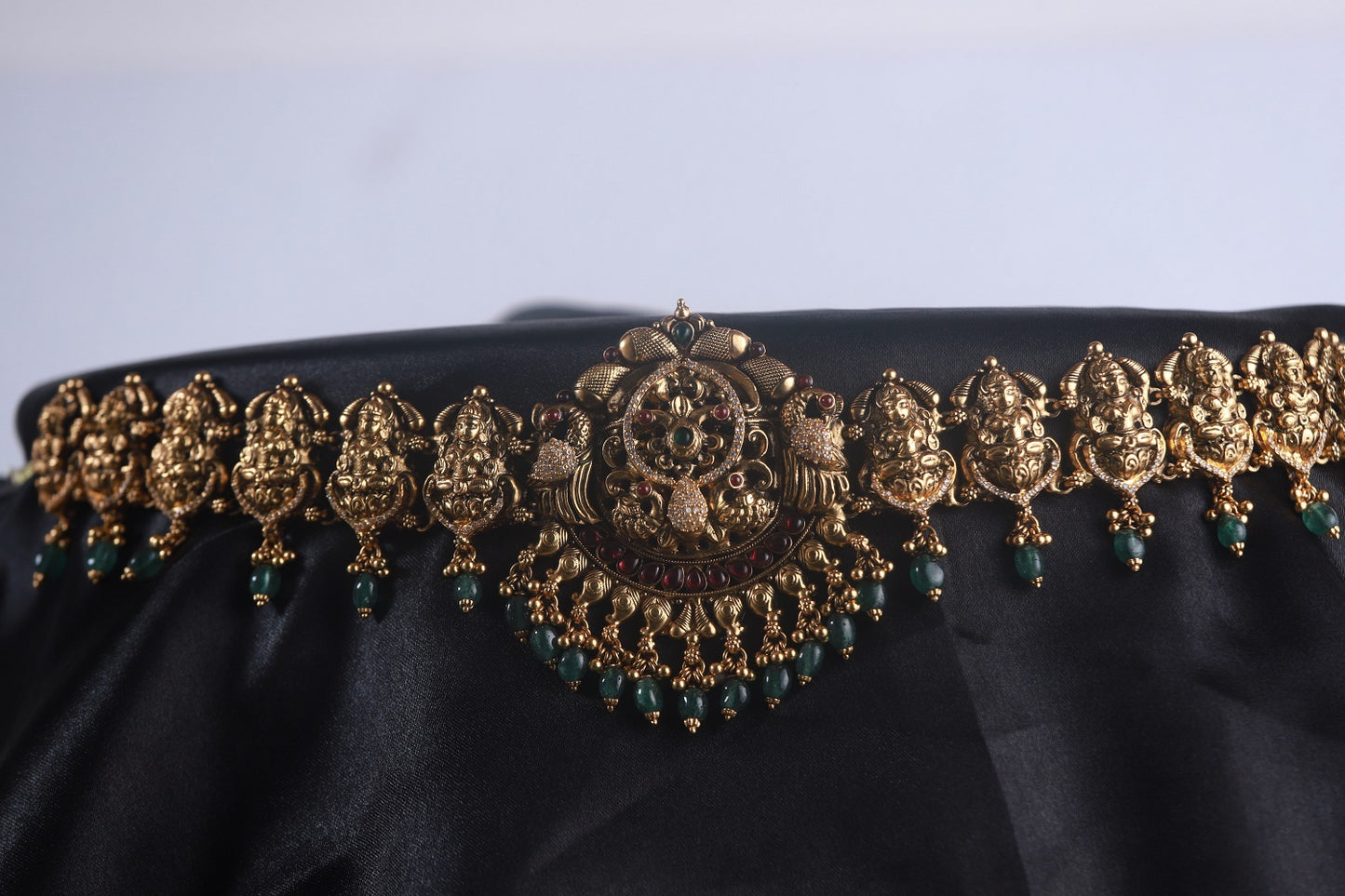 Lakshmi nakshi vaddanam, gold plated 92.5 silver vaddanam featuring intricate temple designs adorning ruby and emerald stones